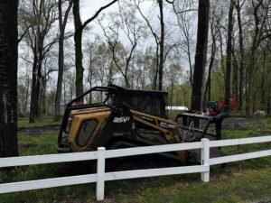 using a skid steer to clear land